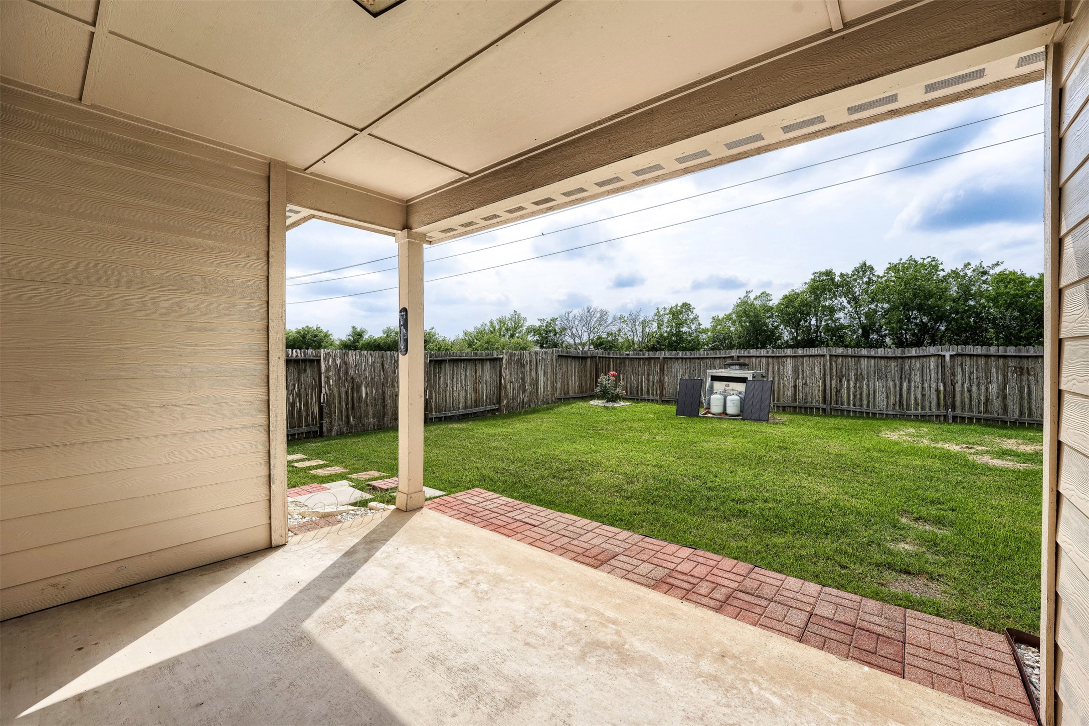 13408 Clara Martin Road Manor, TX 78653 - Photo 25 of 27 a view of a porch with a backyard