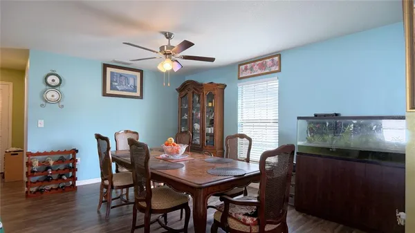 a dining room with furniture and window