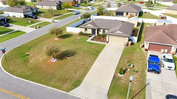 an aerial view of a house with swimming pool