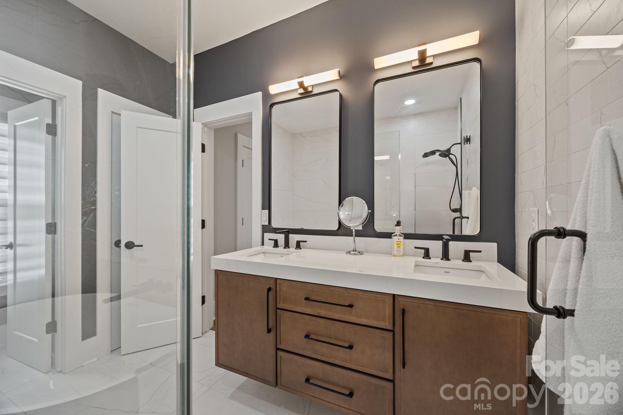241 North Faulkner Way Davidson, NC 28036 - Photo 20 of 39 a bathroom with a double vanity sink mirror and double