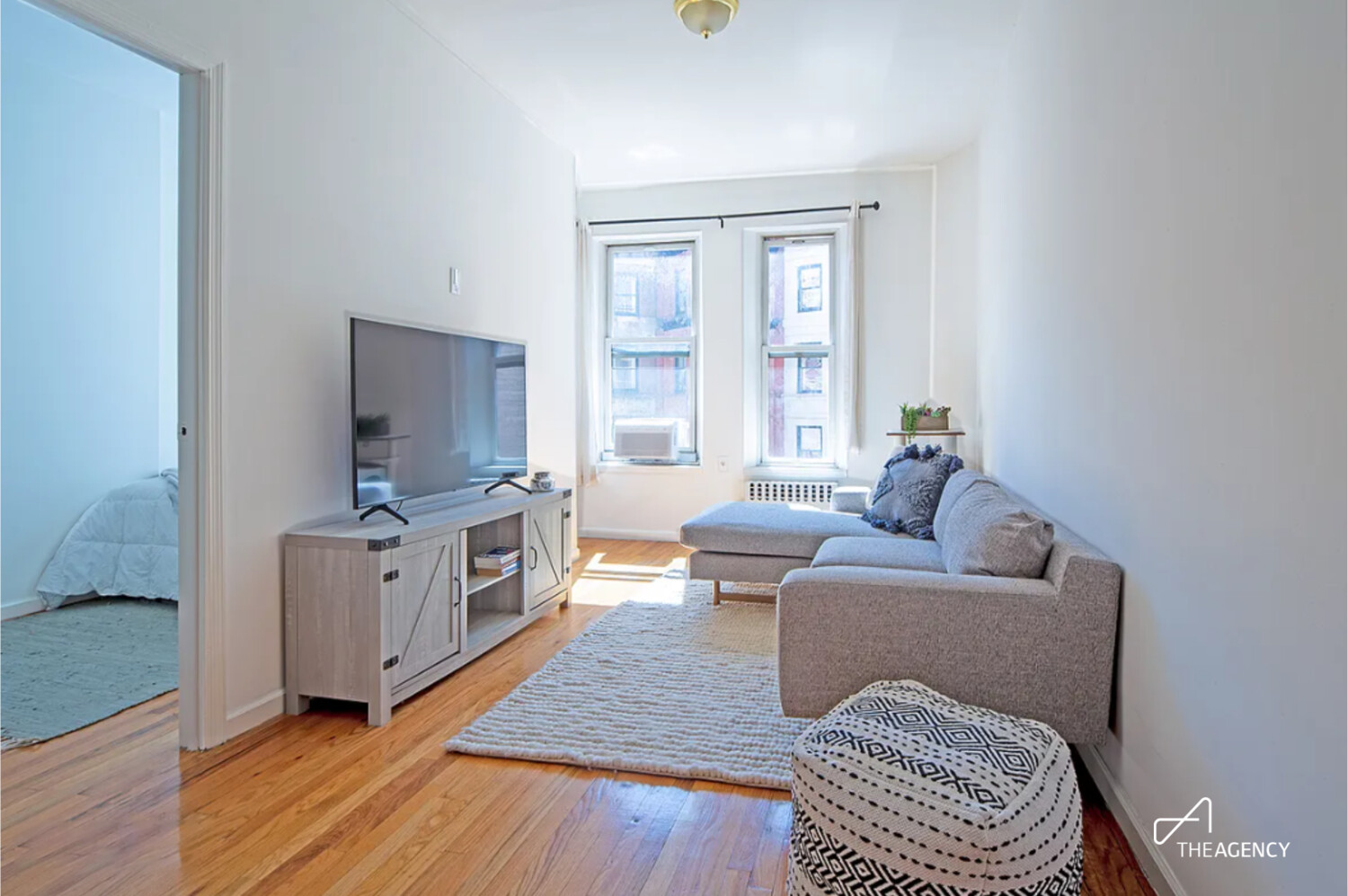 75 West 85th Street, Unit 4A Manhattan, NY 10024 - Photo 1 of 4 a living room with furniture and a flat screen tv