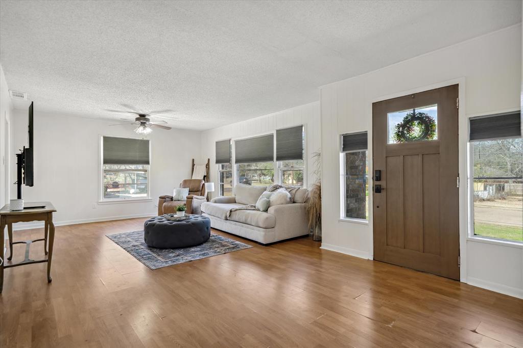 1460 Forrest Drive Canton, TX 75103 - Photo 4 of 36 a living room with furniture and a wooden floor