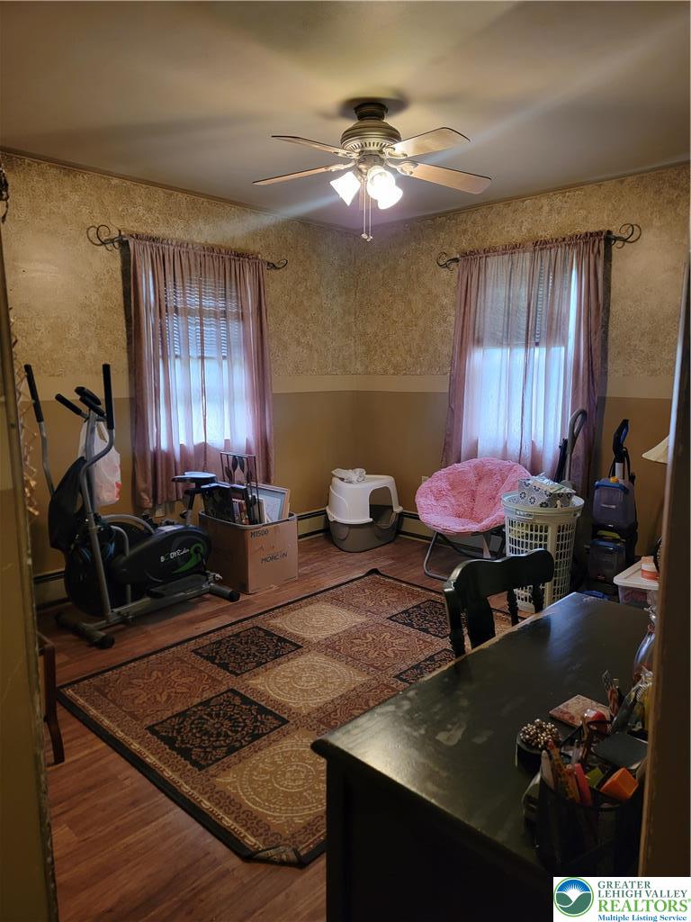 320 Hillside Street Forest City, PA 18421 - Photo 10 of 24 a living room with furniture and a chandelier