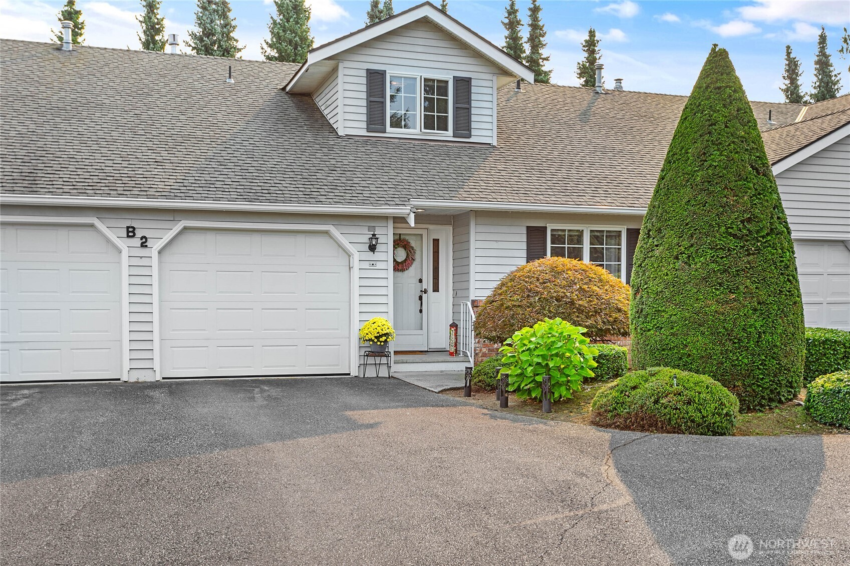 1843 Main Street, Unit B2 Lynden, WA 98264 - Photo 1 of 1 a view of a house with a yard and plants