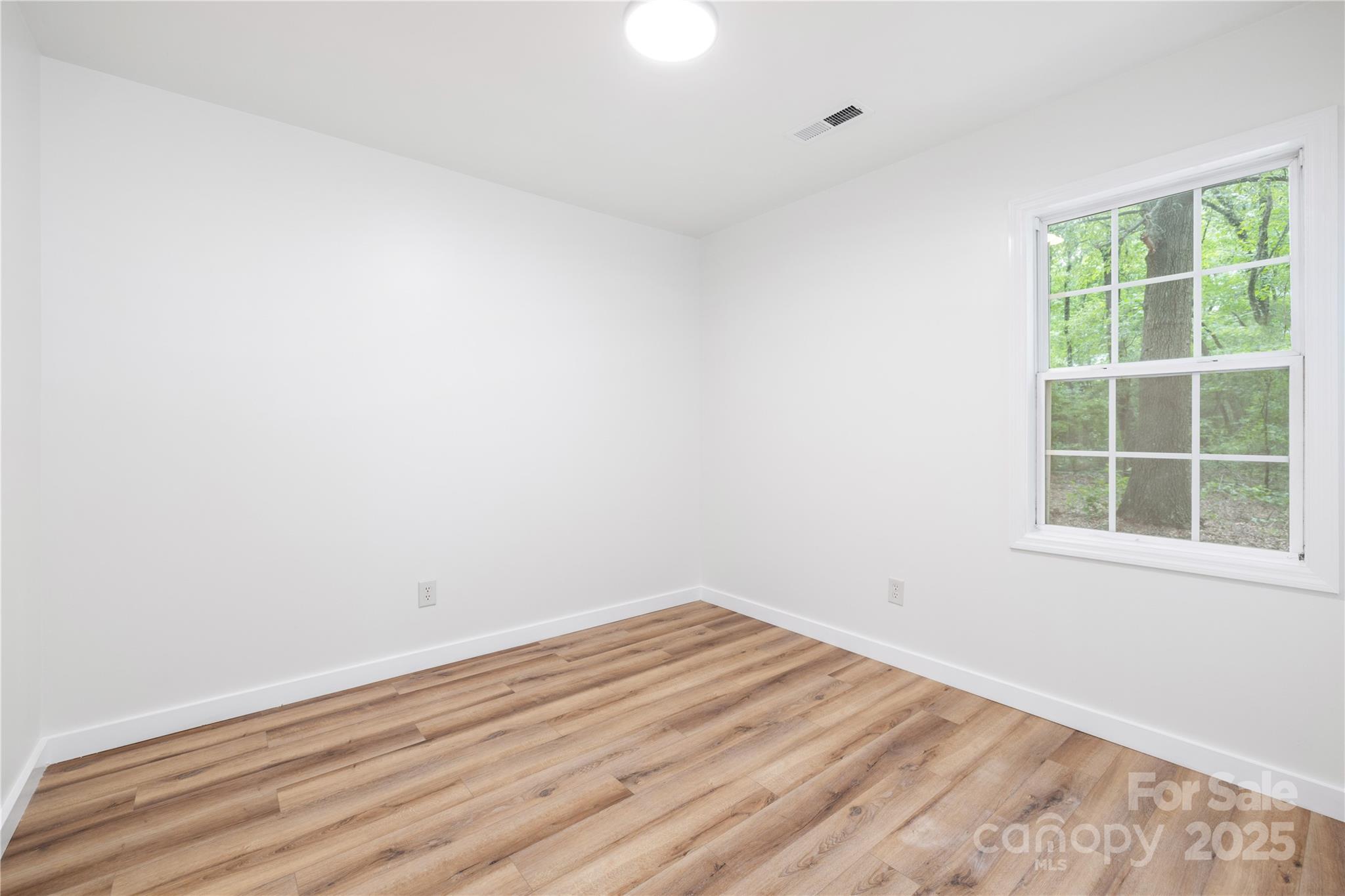 3100 Hickory Grove Drive Monroe, NC 28110 - Photo 12 of 16 an empty room with a window