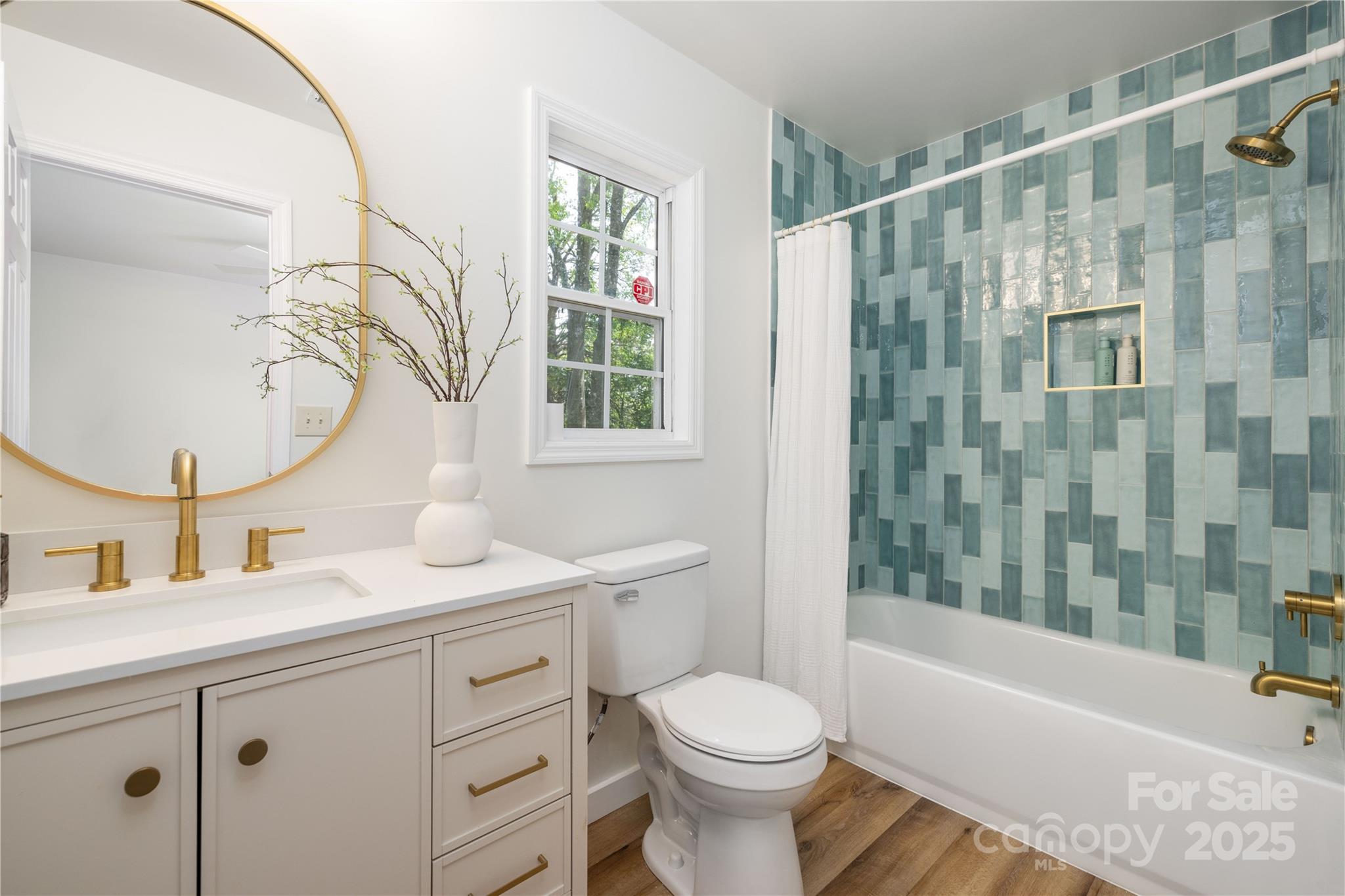 3100 Hickory Grove Drive Monroe, NC 28110 - Photo 8 of 16 a bathroom with a sink toilet a mirror and shower