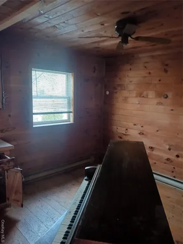 a view of a room that has a bed