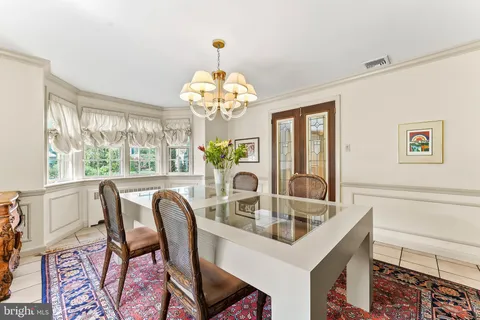 a kitchen with stainless steel appliances kitchen island granite countertop a stove a sink and a microwave