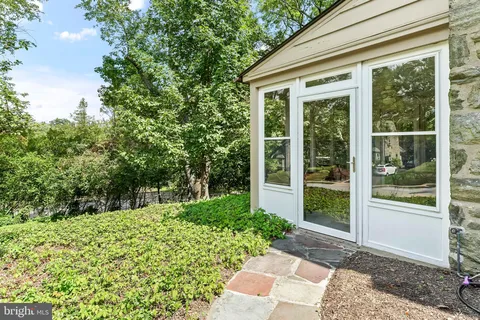 an aerial view of a house with outdoor space