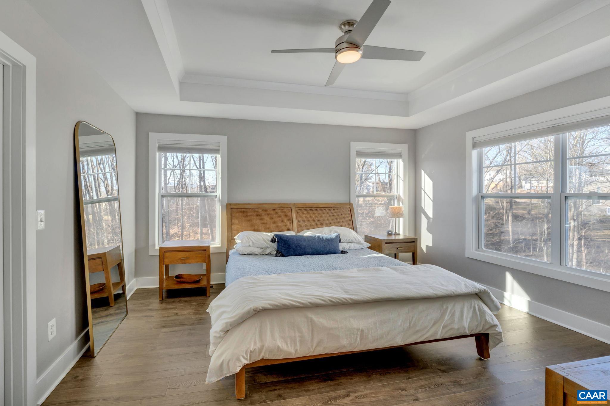 113 Paynes Mill Road Charlottesville, VA 22902 - Photo 45 of 75 a bedroom with a large bed and a window