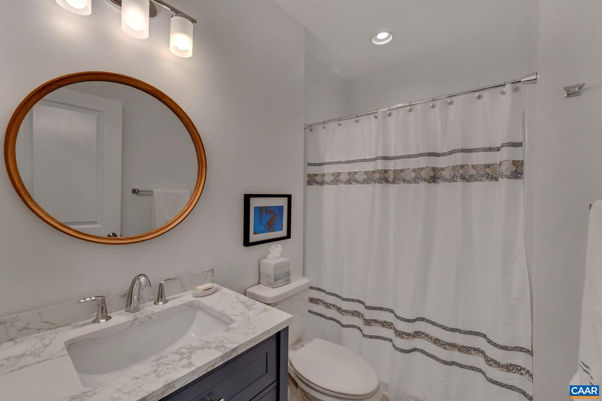 113 Paynes Mill Road Charlottesville, VA 22902 - Photo 53 of 75 a bathroom with a granite countertop sink and a mirror