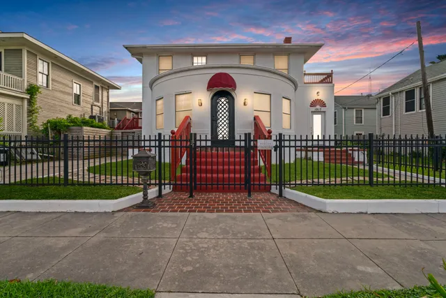 a view of a wrought iron fences in front of a building