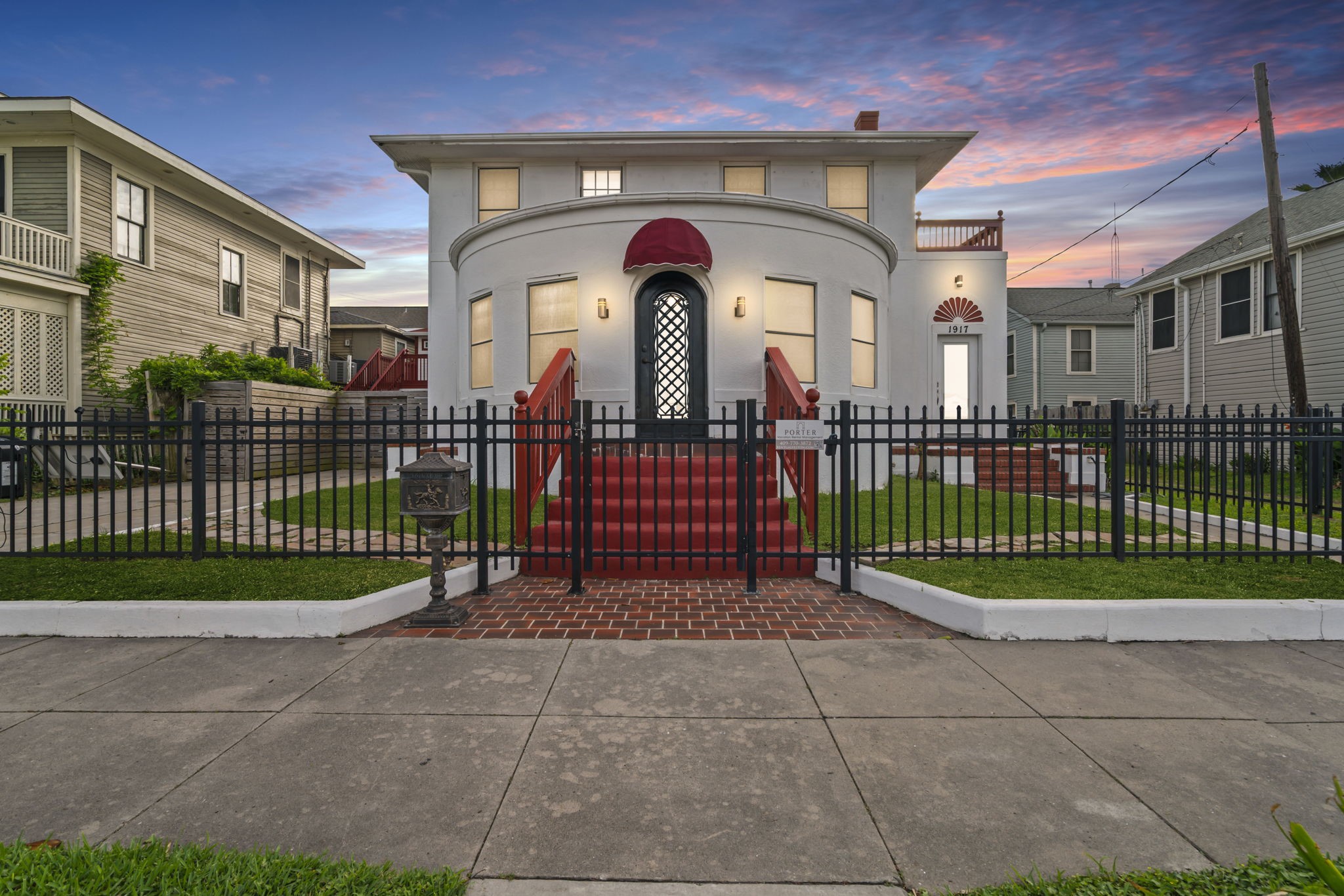 a view of a wrought iron fences in front of a building