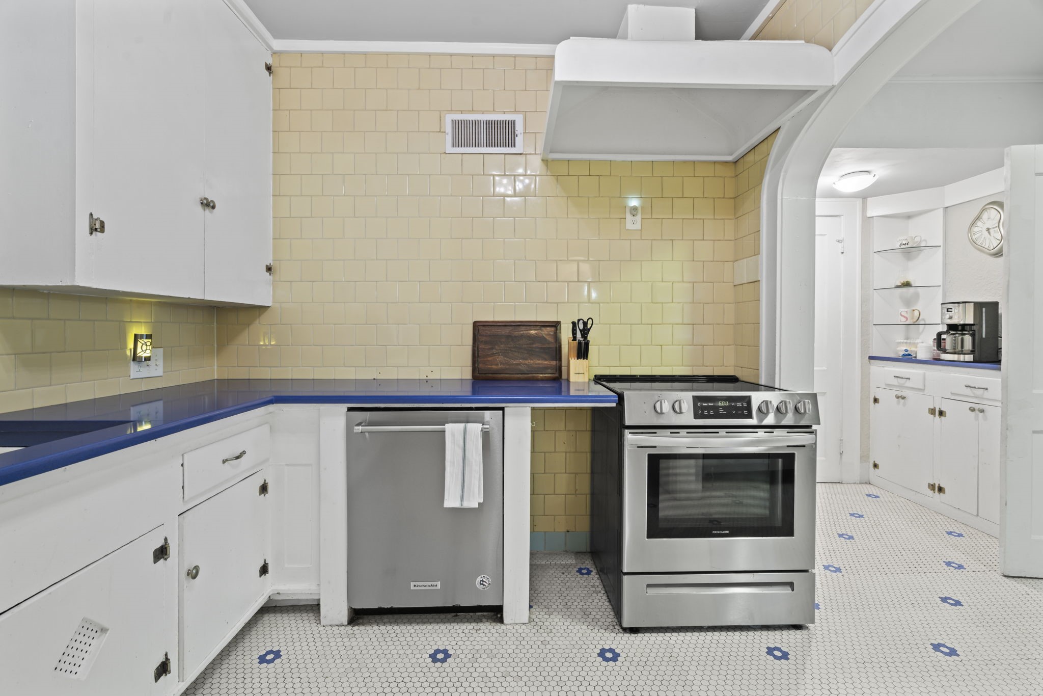 1919 Rosenberg Street Galveston, TX 77550 - Photo 12 of 25 a kitchen with white cabinets and white appliances