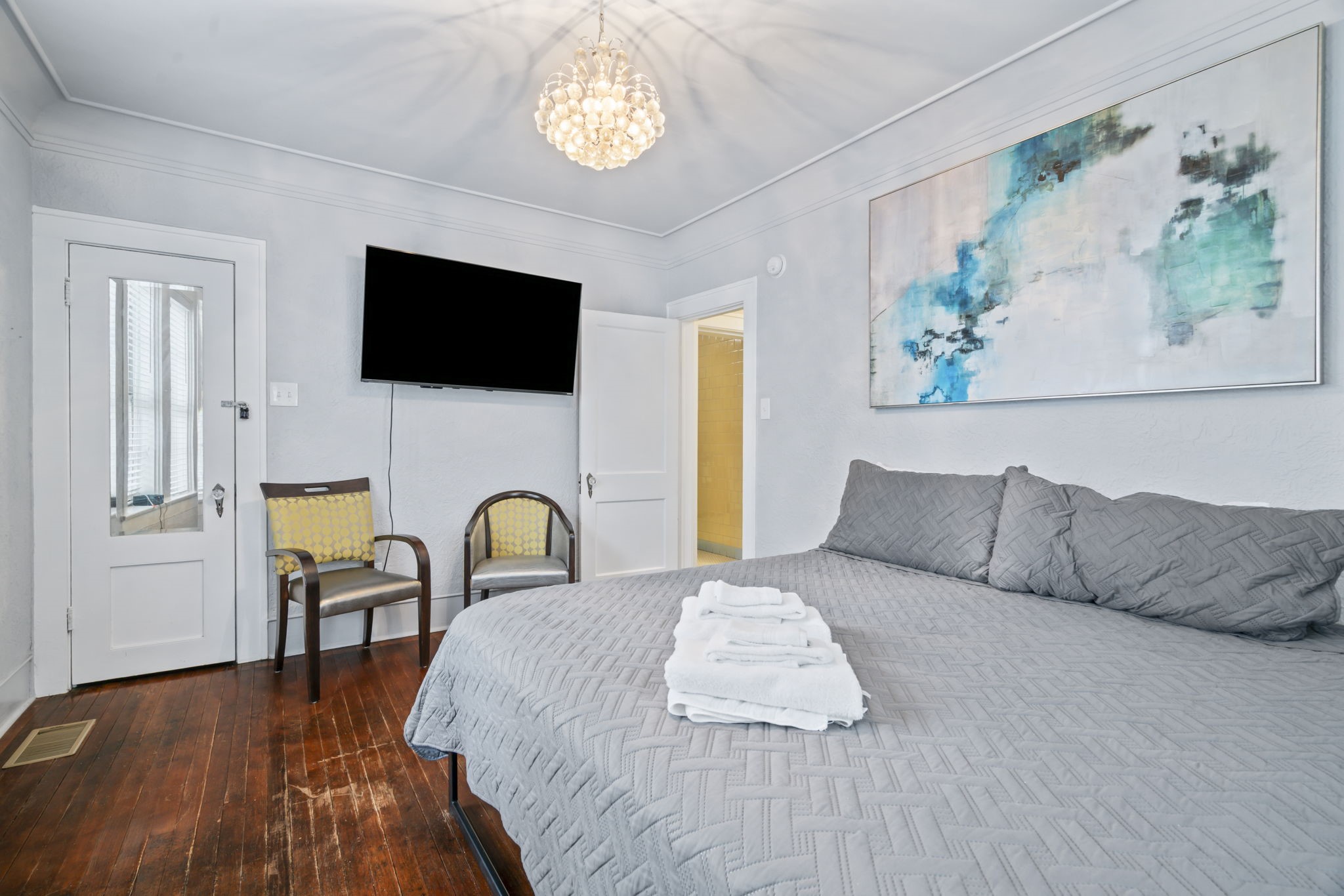 1919 Rosenberg Street Galveston, TX 77550 - Photo 13 of 25 a bedroom with a bed and a flat screen tv