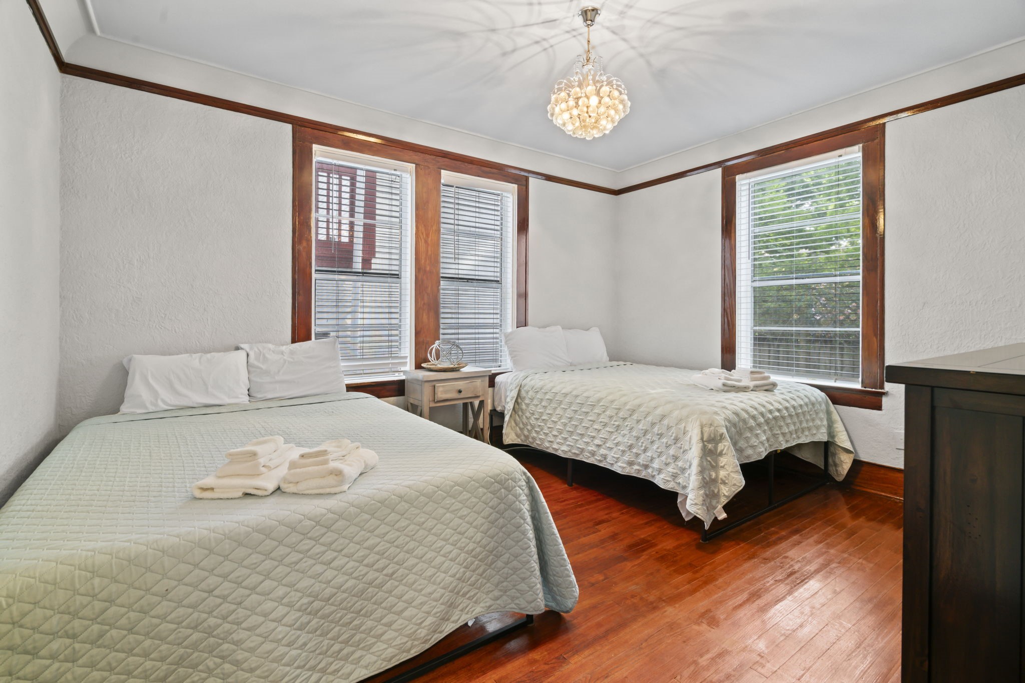 1919 Rosenberg Street Galveston, TX 77550 - Photo 14 of 25 a bedroom with a large bed and a large window