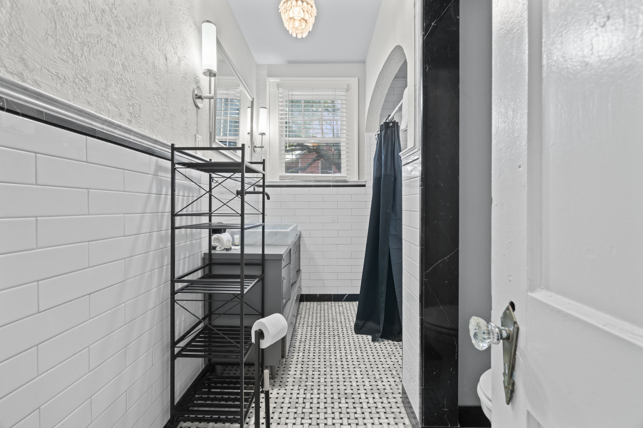 1919 Rosenberg Street Galveston, TX 77550 - Photo 16 of 25 a bathroom with a sink toilet and shower