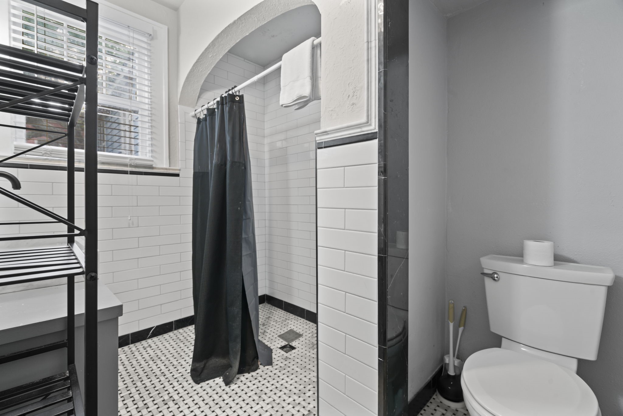 1919 Rosenberg Street Galveston, TX 77550 - Photo 17 of 25 a bathroom with a toilet and a shower