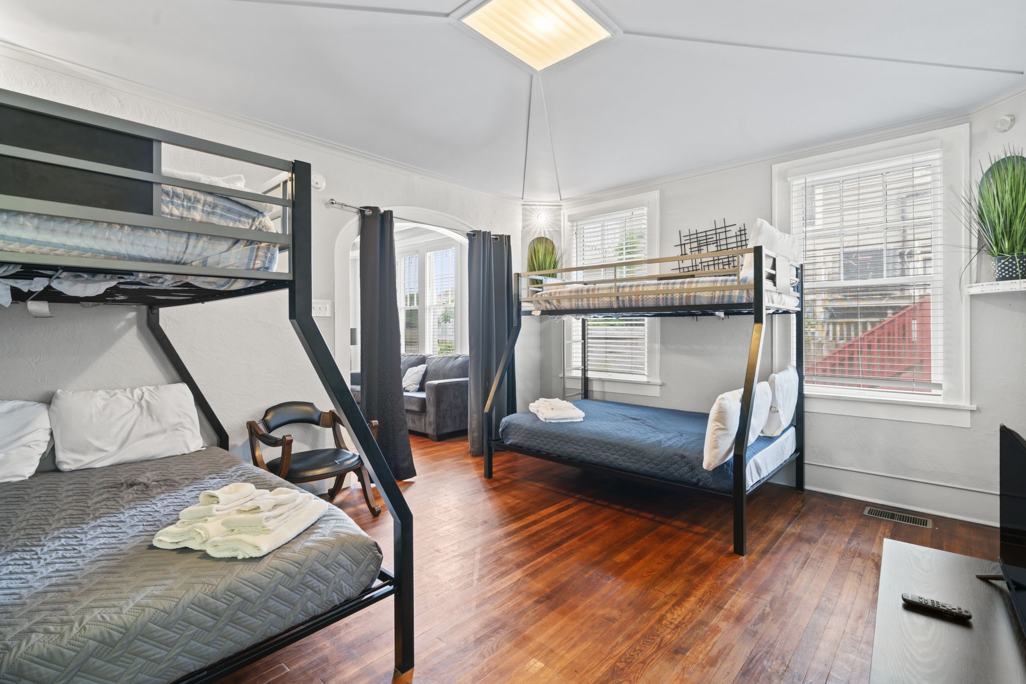 1919 Rosenberg Street Galveston, TX 77550 - Photo 25 of 25 a bedroom with furniture and a wooden floor