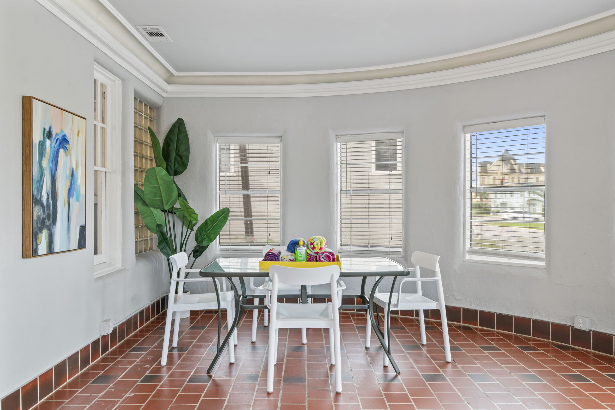 1919 Rosenberg Street Galveston, TX 77550 - Photo 4 of 25 a view of a dining room with furniture and a potted plant