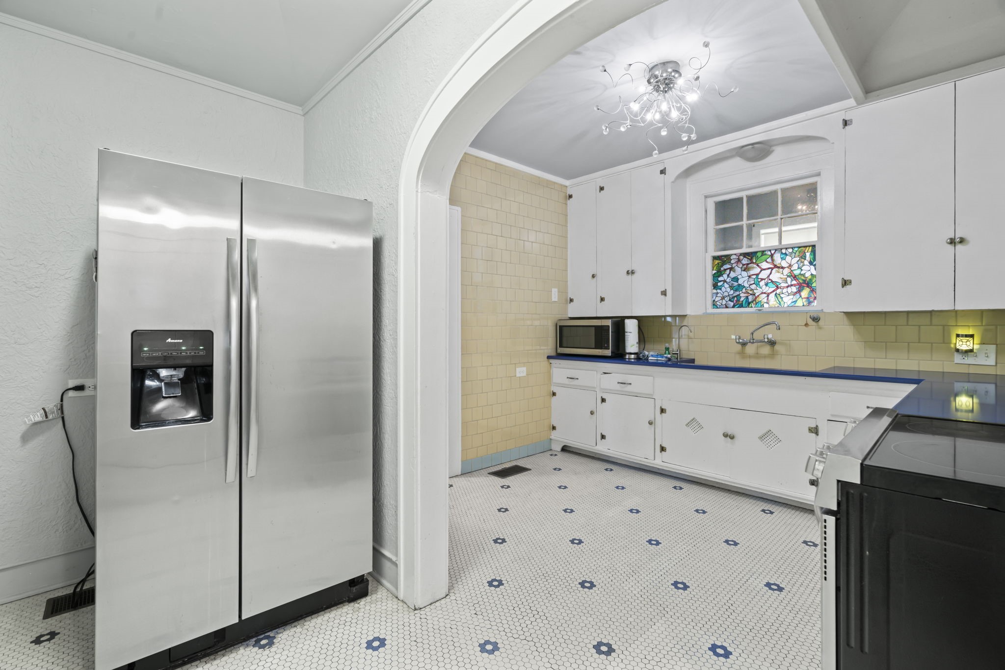 1919 Rosenberg Street Galveston, TX 77550 - Photo 8 of 25 a kitchen with cabinets appliances and a counter space