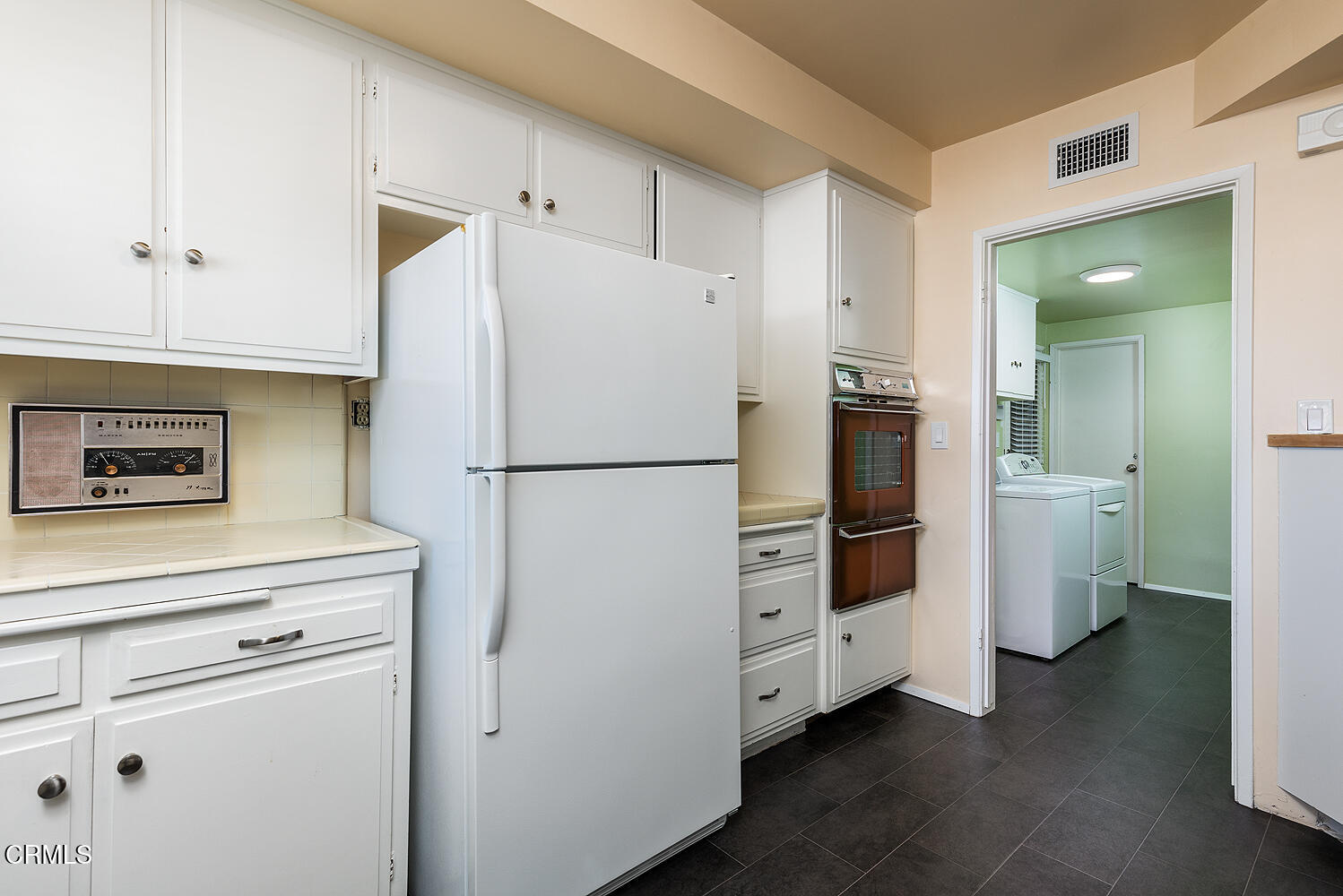 501 Martos Drive South Pasadena, CA 91030 - Photo 18 of 31 a kitchen with appliances a refrigerator and cabinets
