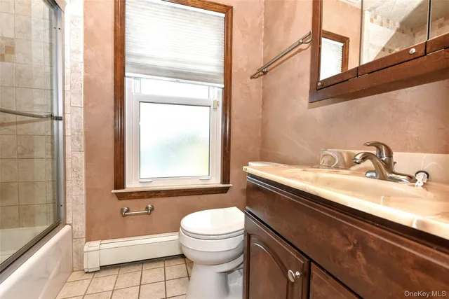 a bathroom with a sink a toilet and a bathtub