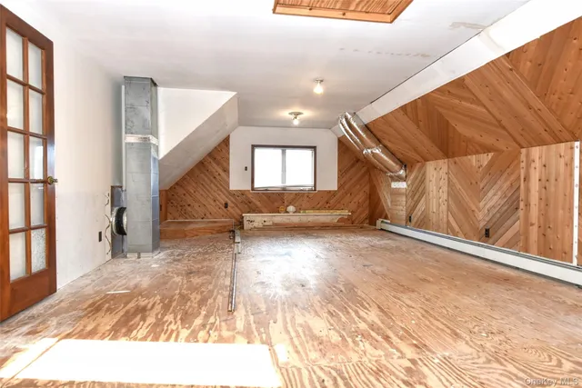 a view of a room with wooden floor and stairs