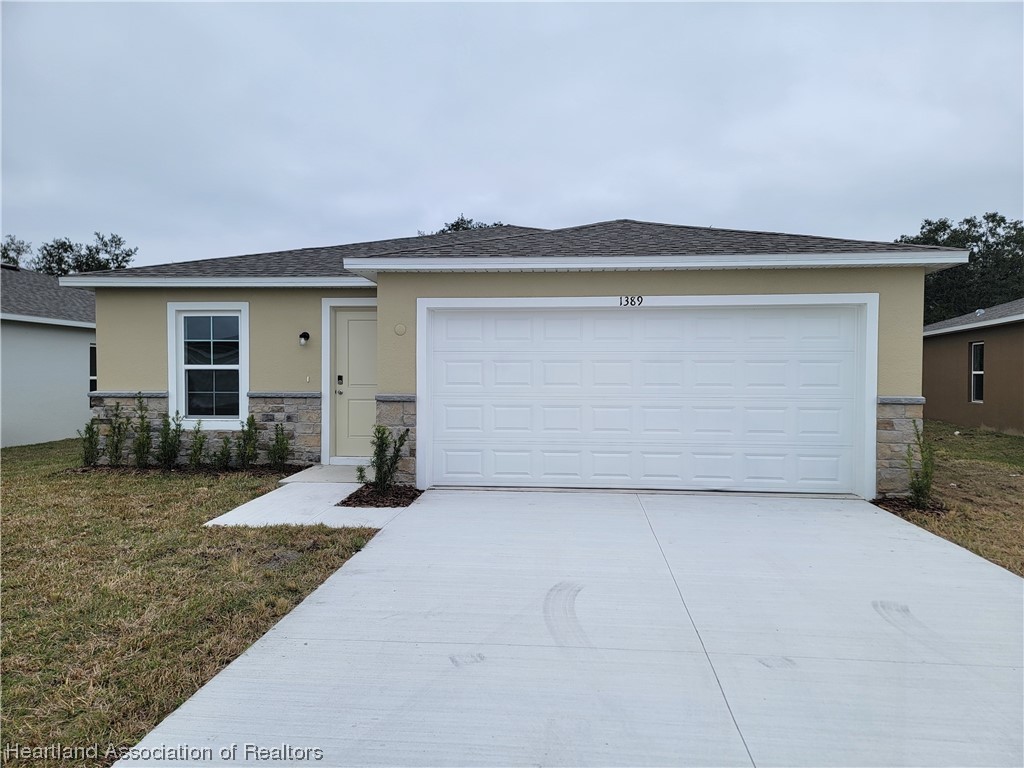 1389 Stone Circle Sebring, FL 33870 - Photo 1 of 39 front view of a house with a yard