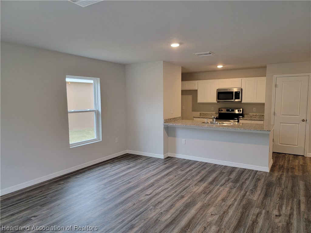 1389 Stone Circle Sebring, FL 33870 - Photo 3 of 39 a view of kitchen and microwave