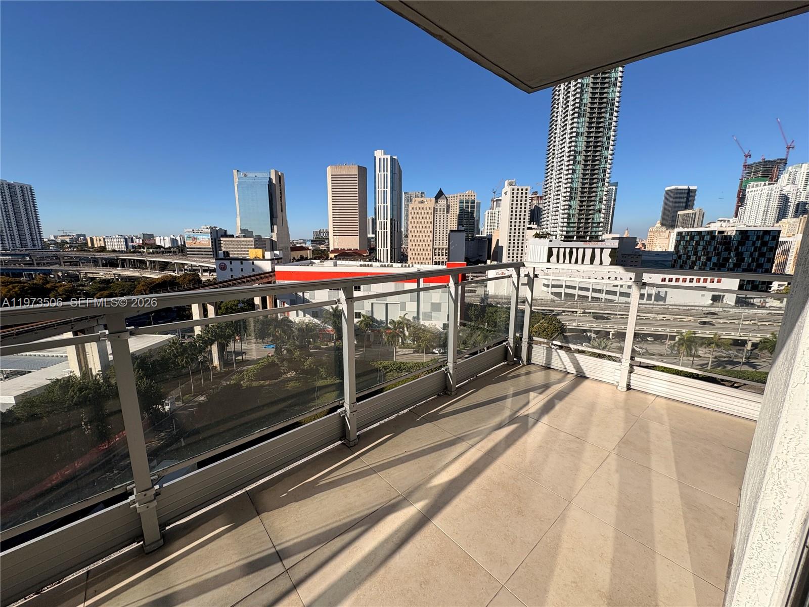 90 Southwest 3rd Street, Unit 1205 Miami, FL 33130 - Photo 16 of 41 a view of a kitchen with stainless steel appliances granite countertop a stove and a sink