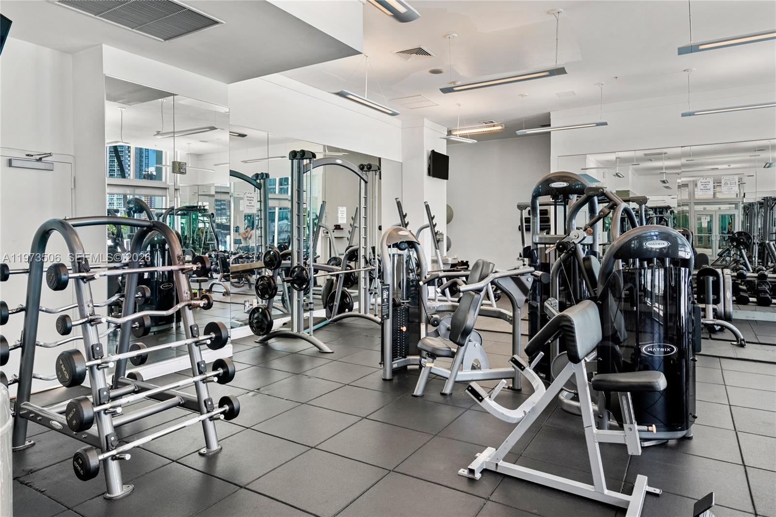 90 Southwest 3rd Street, Unit 1205 Miami, FL 33130 - Photo 23 of 41 a view of a room with gym equipment