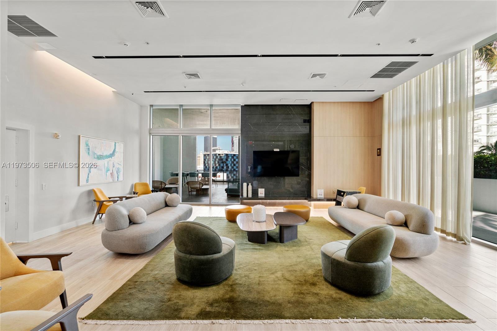 90 Southwest 3rd Street, Unit 1205 Miami, FL 33130 - Photo 34 of 41 a living room with furniture and a large window