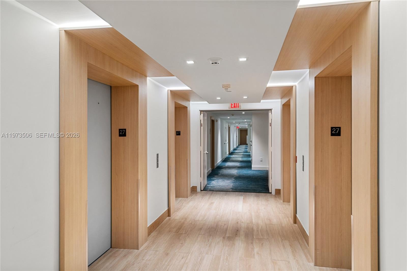 90 Southwest 3rd Street, Unit 1205 Miami, FL 33130 - Photo 36 of 41 a view of a hallway with wooden floor and windows