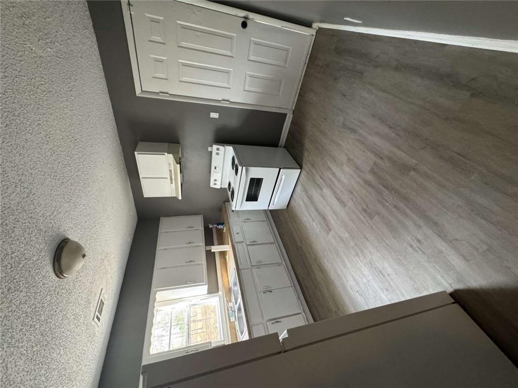 2235 A Moncrieff Street Augusta, GA 30906 - Photo 8 of 10 a kitchen with a white stove top oven and sink
