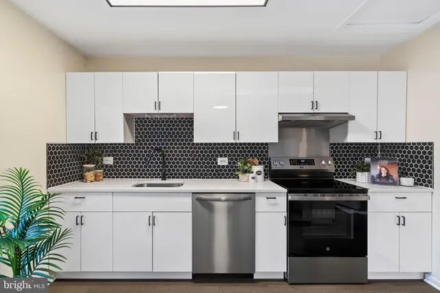 a kitchen with a stove and a cabinets
