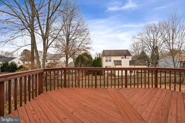 a view of balcony with wooden floor and fence
