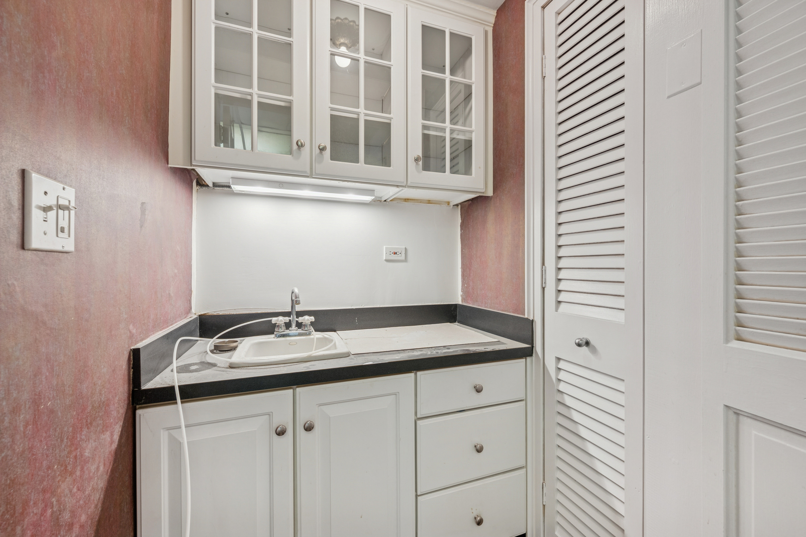 5555 North Sheridan Road, Unit 602 Chicago, IL 60640 - Photo 12 of 20 a bathroom with a sink and a mirror