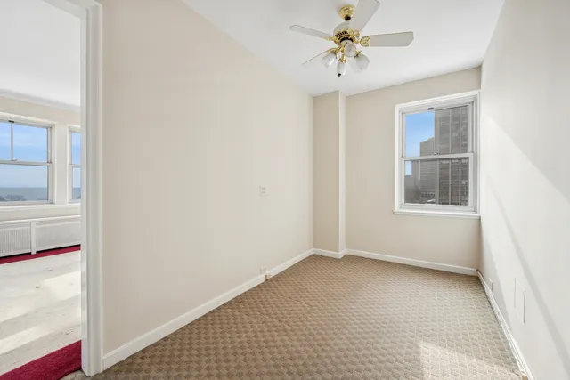 a view of an empty room with a window