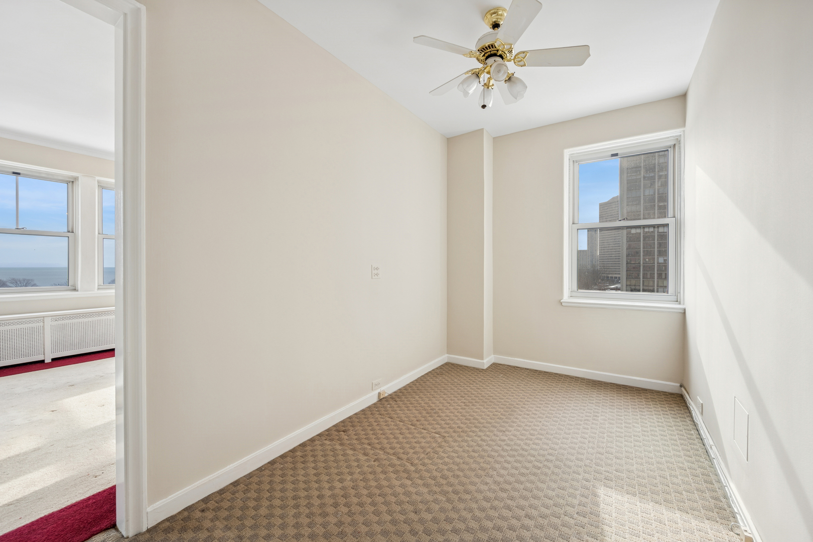 5555 North Sheridan Road, Unit 602 Chicago, IL 60640 - Photo 7 of 20 a view of an empty room with a window