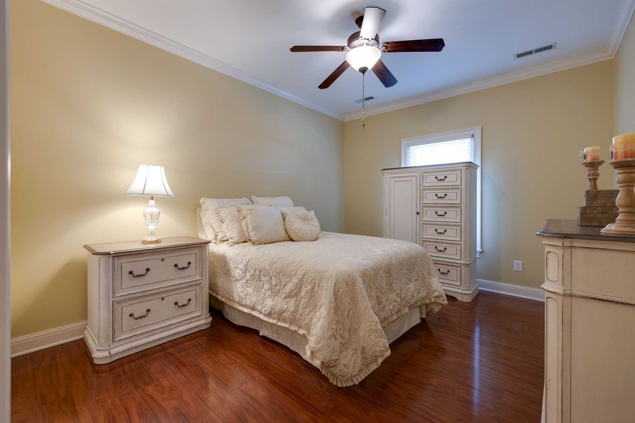 122 Riley Circle Fayetteville, TN 37334 - Photo 20 of 31 a bedroom with a bed and a chandelier