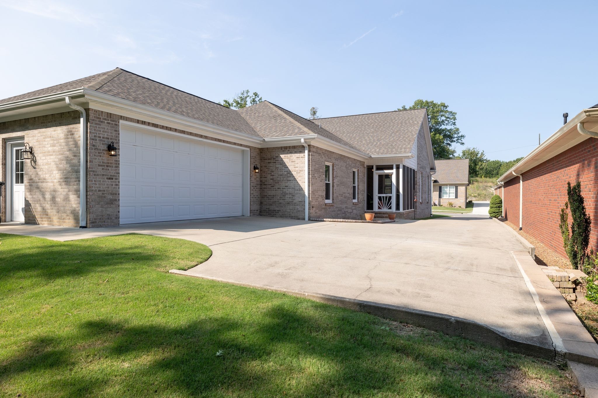 122 Riley Circle Fayetteville, TN 37334 - Photo 27 of 31 a view of a white house next to a yard with big trees