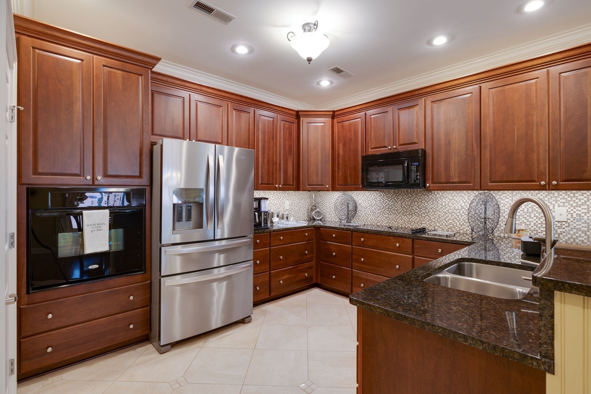 122 Riley Circle Fayetteville, TN 37334 - Photo 10 of 31 a kitchen with granite countertop wooden cabinets and stainless steel appliances
