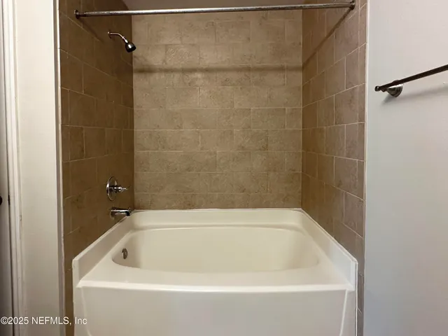 a bathroom with a bathtub