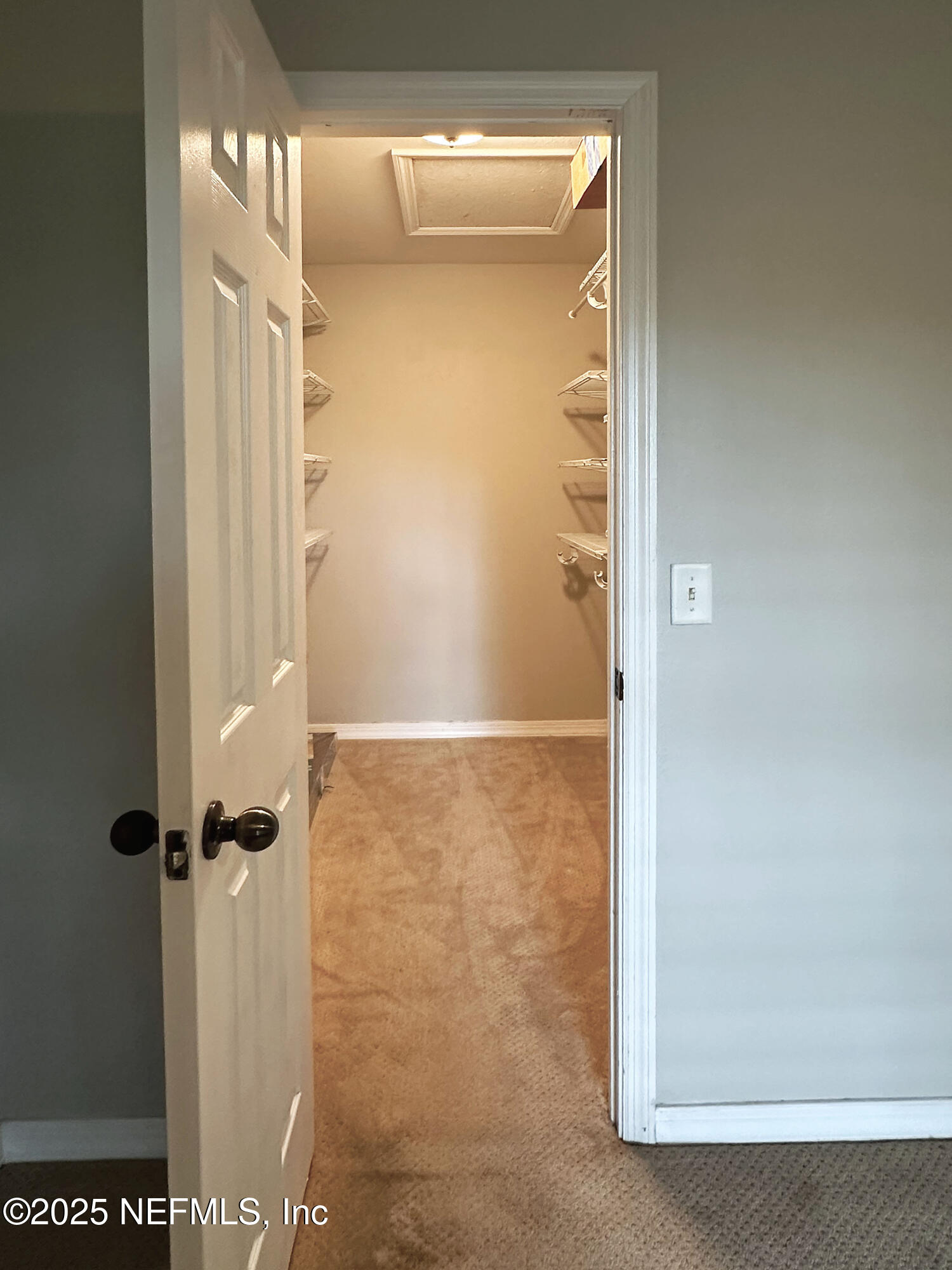 7800 Point Meadows Drive, Unit 631 Jacksonville, FL 32256 - Photo 25 of 26 a bathroom with a glass shower door