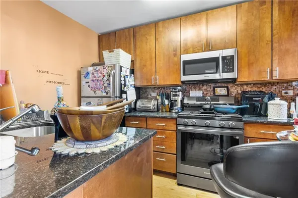 a kitchen with a stove and a microwave