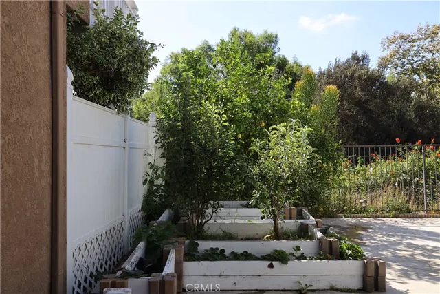 a view of a patio with couches and a fire pit