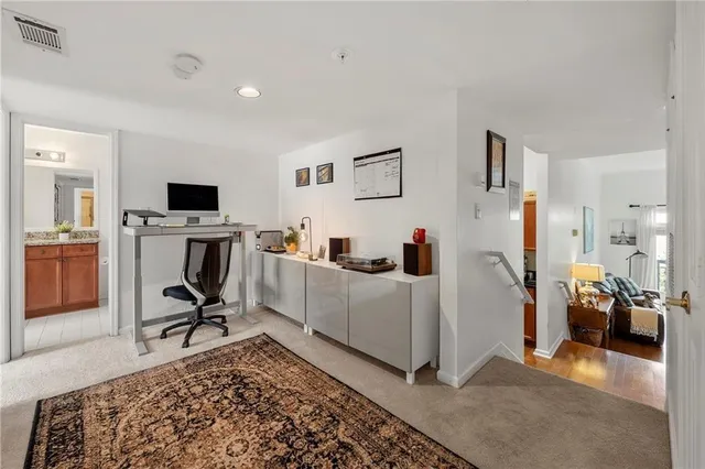 a room with a couch and a rug