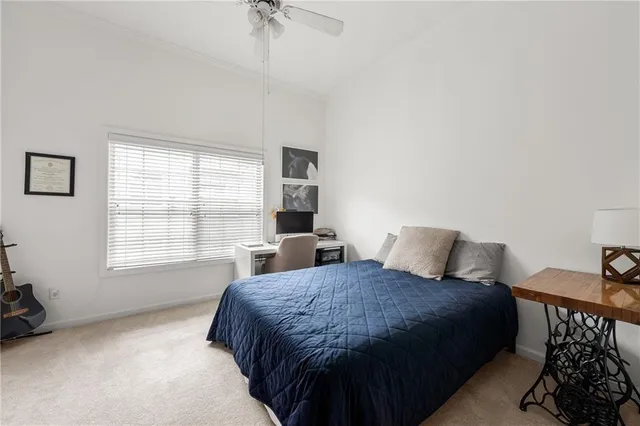 a spacious bedroom with a bed and a couch