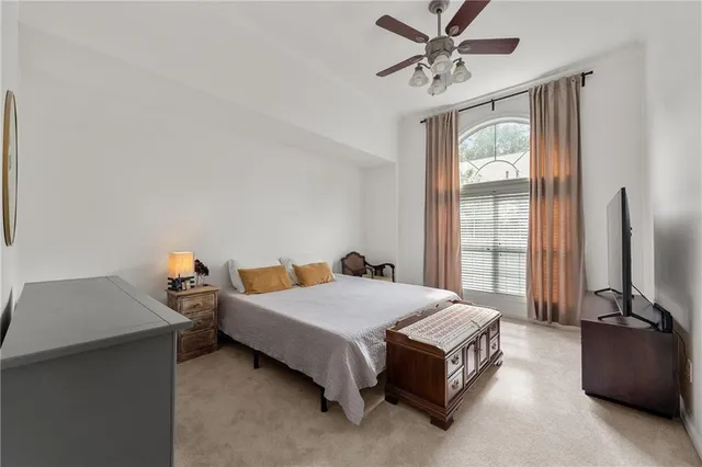 a room with lots of furniture and a book shelf